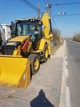Inchiriere Buldoexcavator caterpillar cu picon si autobasculante 8x4